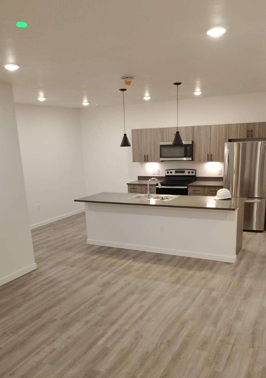 New kitchen with a hard hat on the island after a clean. Photo from Lauri’s site.